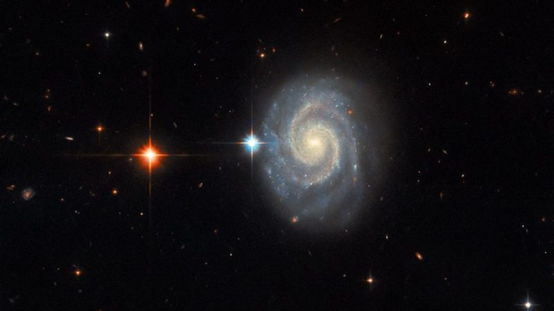 Hubble image shows the "forbidden" light coming from a distant spiral galaxy, MCG-01-24-014